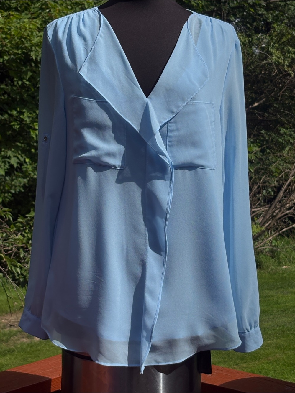 Calvin Klein light blue blouse. Absolutely no flaws,with sheer sleeve.